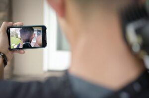 man using cutcam with app on phone