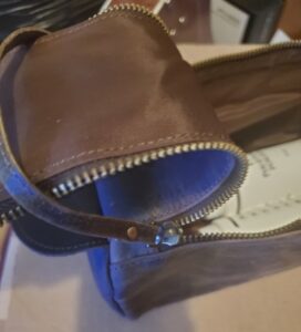 lid held open by leather strap