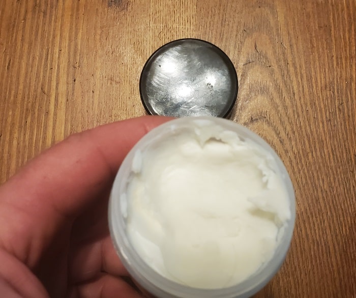 open jar of putty