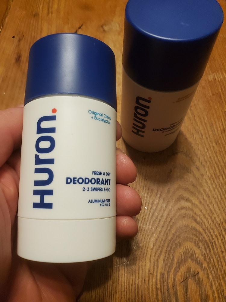 hand holding deodorant