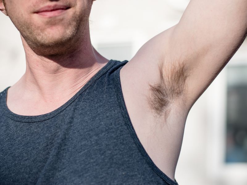 man showing armpit